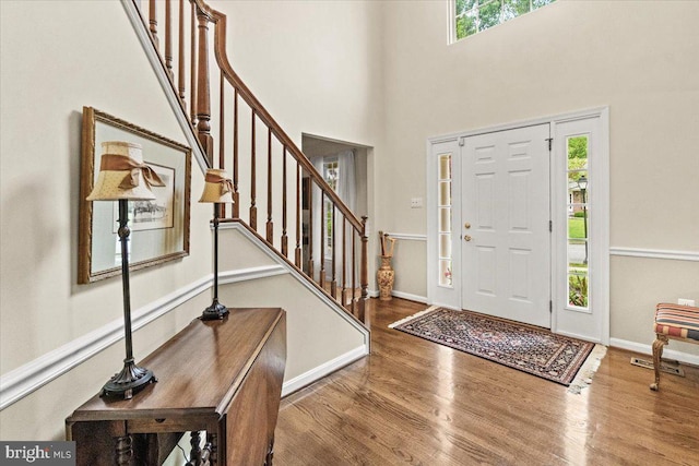 2218 W Greenleaf Dr W, Frederick, MD 21702 - entrance foyer with wood finished floors, stairway, a towering ceiling, and baseboards
