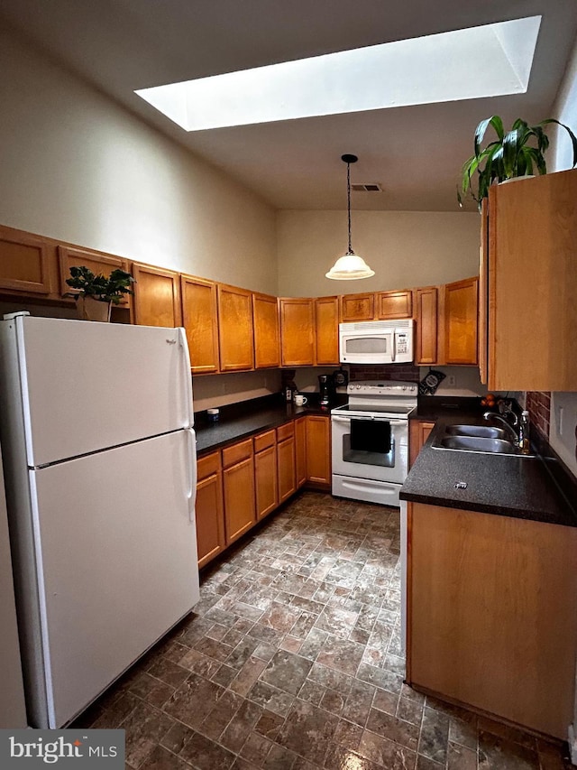 331 Lora Dr, Woodstock, VA 22664 - kitchen with white appliances, a skylight, a sink, brown cabinets, and dark countertops