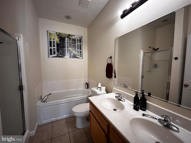 331 Lora Dr, Woodstock, VA 22664 - full bath with a stall shower, tile patterned floors, a bath, a textured ceiling, and double vanity