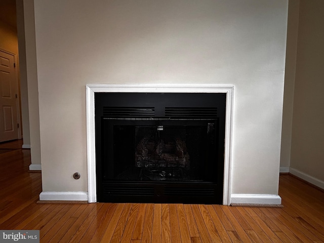331 Lora Dr, Woodstock, VA 22664 - detailed view of a fireplace, baseboards, and wood finished floors