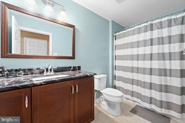 full bathroom with vanity, toilet, tile patterned floors, and a shower with curtain