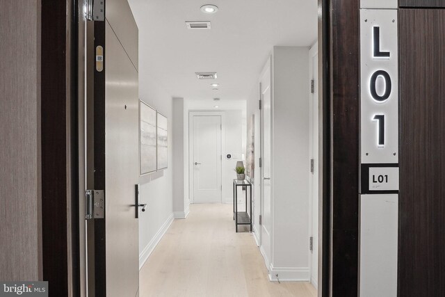 1427 Rhode Island Ave NW Unit L01, Washington, DC 20005 - hallway featuring light wood finished floors and baseboards