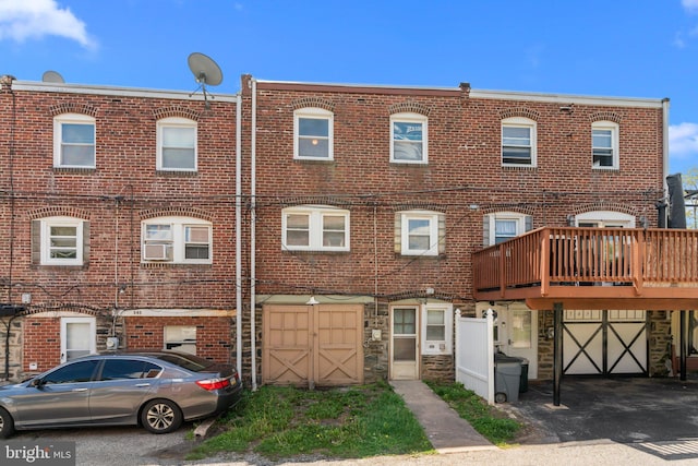 view of property featuring brick siding