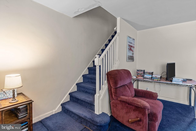 staircase with carpet flooring and baseboards
