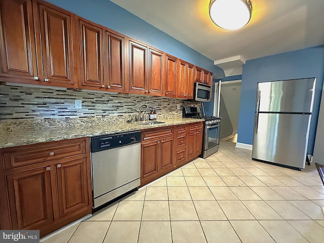 1206 Cedarcroft Rd, Baltimore, MD 21239 - kitchen with stainless steel appliances, backsplash, a sink, and light stone counters