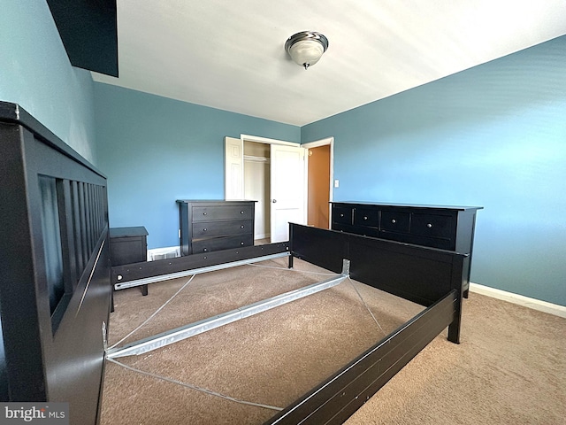 1206 Cedarcroft Rd, Baltimore, MD 21239 - bedroom with carpet flooring, a closet, and baseboards
