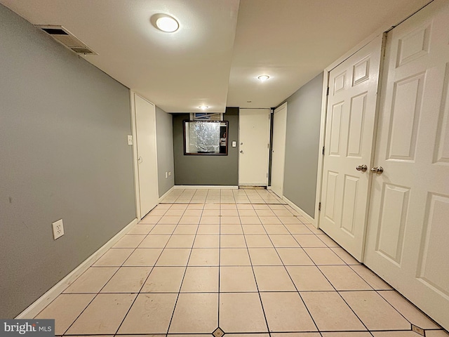 1206 Cedarcroft Rd, Baltimore, MD 21239 - hall featuring light tile patterned floors and baseboards