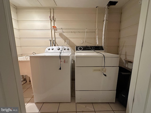 1206 Cedarcroft Rd, Baltimore, MD 21239 - washroom featuring washer and clothes dryer and light tile patterned floors