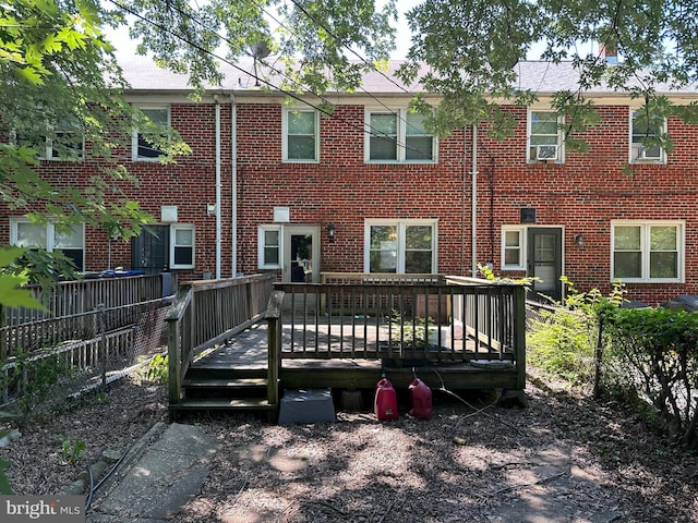 1206 Cedarcroft Rd, Baltimore, MD 21239 - rear view of house with brick siding and a wooden deck