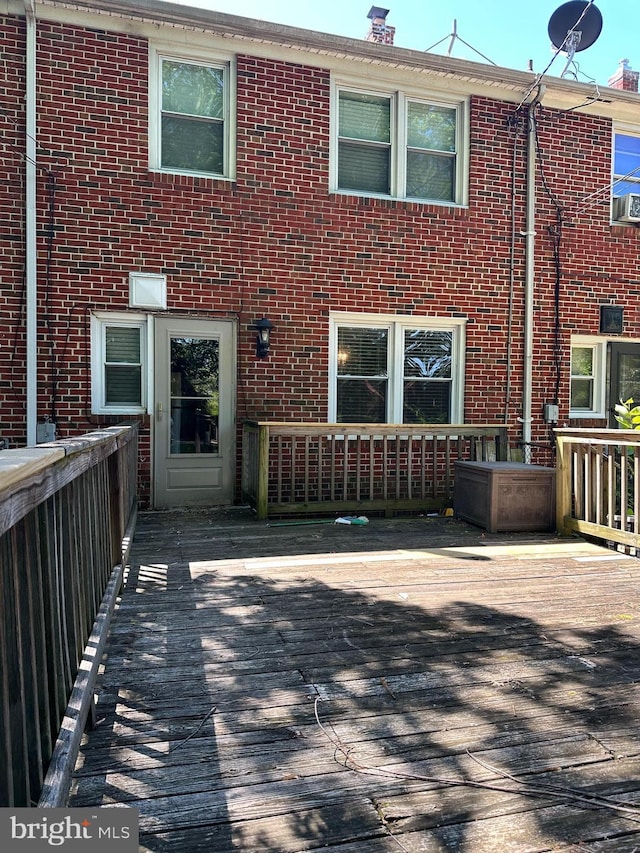 1206 Cedarcroft Rd, Baltimore, MD 21239 - rear view of house with a wooden deck and brick siding