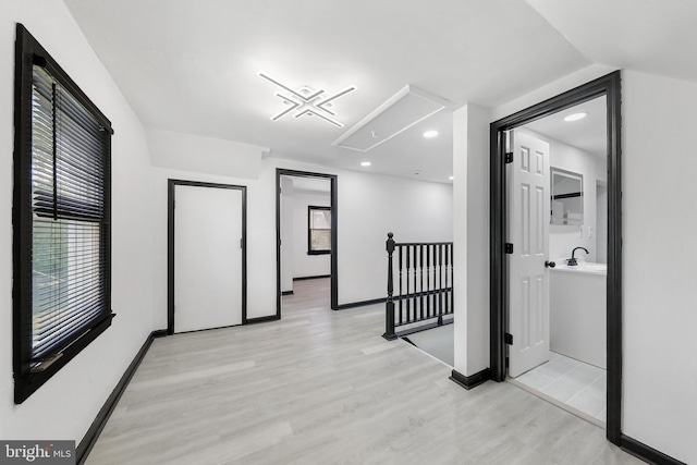 bonus room with attic access, light wood finished floors, baseboards, and recessed lighting