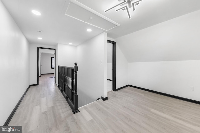 bonus room featuring wood finished floors, baseboards, vaulted ceiling, and recessed lighting