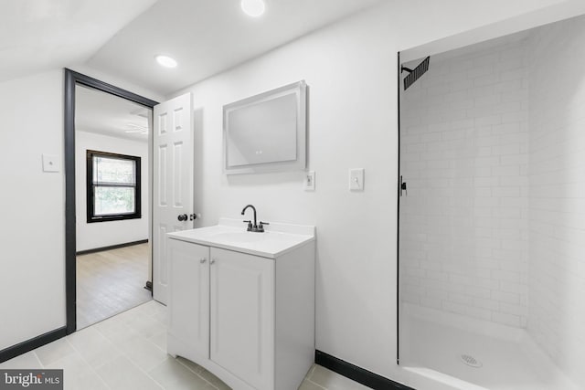 full bathroom with a stall shower, vanity, baseboards, tile patterned floors, and recessed lighting
