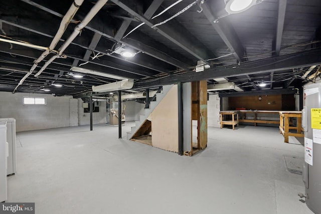 basement with electric water heater, stairs, and heating unit