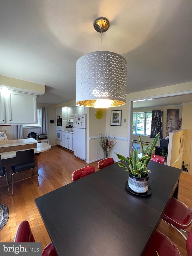 99 Exeter Ct, Shepherdstown, WV 25443 - dining area featuring light wood-style floors and healthy amount of natural light