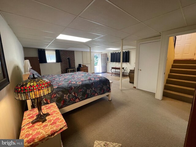 99 Exeter Ct, Shepherdstown, WV 25443 - carpeted bedroom with a drop ceiling and a wood stove