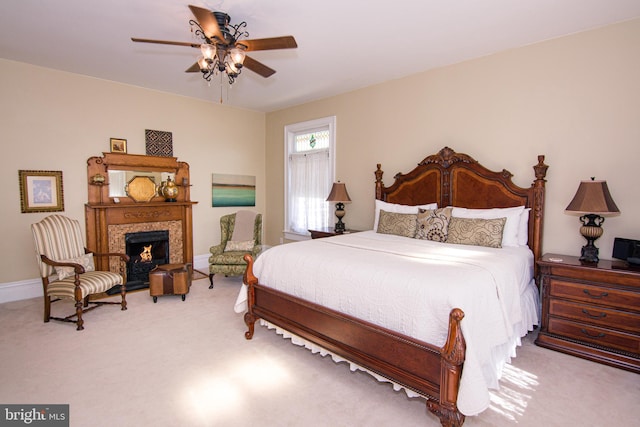 301 Meyers Ave, Meyersdale, PA 15552 - bedroom with carpet flooring, baseboards, a warm lit fireplace, and a ceiling fan