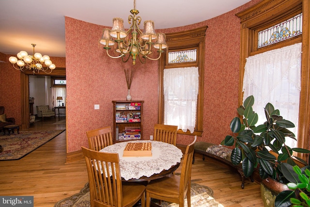 301 Meyers Ave, Meyersdale, PA 15552 - dining room with a chandelier, wood finished floors, healthy amount of natural light, and wallpapered walls
