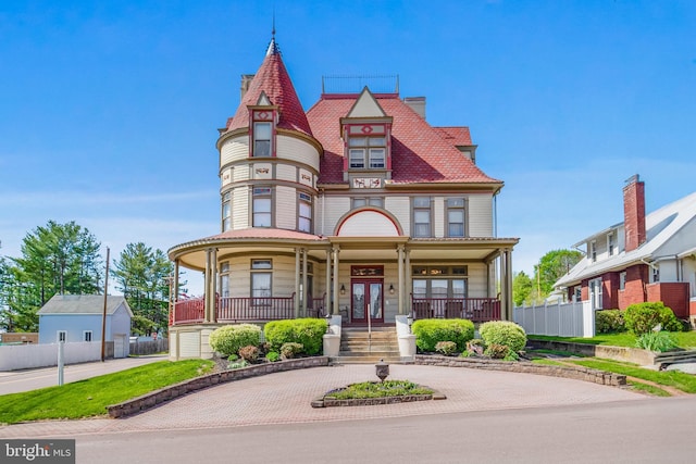 301 Meyers Ave, Meyersdale, PA 15552 - victorian home with a porch, fence, and french doors