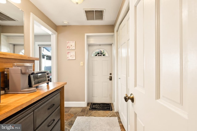 301 Meyers Ave, Meyersdale, PA 15552 - doorway to outside featuring baseboards and dark stone finish floors