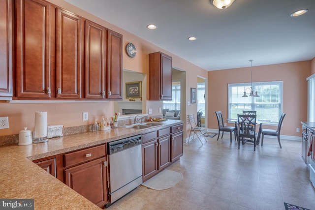 328 Gillibrook Ln, Dover, DE 19904 - kitchen with stainless steel dishwasher, light countertops, a sink, recessed lighting, and decorative light fixtures