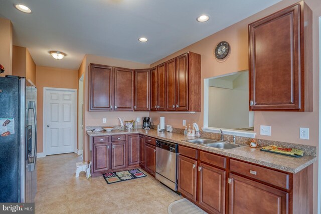 328 Gillibrook Ln, Dover, DE 19904 - kitchen with appliances with stainless steel finishes, a sink, light countertops, recessed lighting, and brown cabinetry