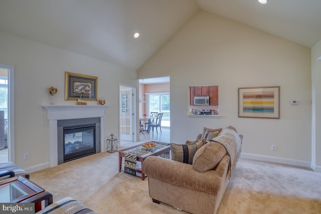 328 Gillibrook Ln, Dover, DE 19904 - living room with light colored carpet, high vaulted ceiling, a multi sided fireplace, recessed lighting, and baseboards