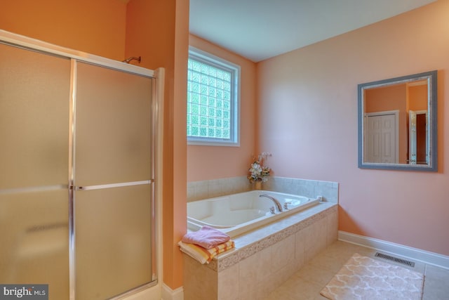 328 Gillibrook Ln, Dover, DE 19904 - bathroom featuring a shower stall, a bath, baseboards, and tile patterned floors