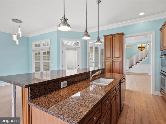 27173 Barefoot Blvd Unit 15, Millsboro, DE 19966 - kitchen with a sink, an island with sink, light wood finished floors, stainless steel dishwasher, and crown molding