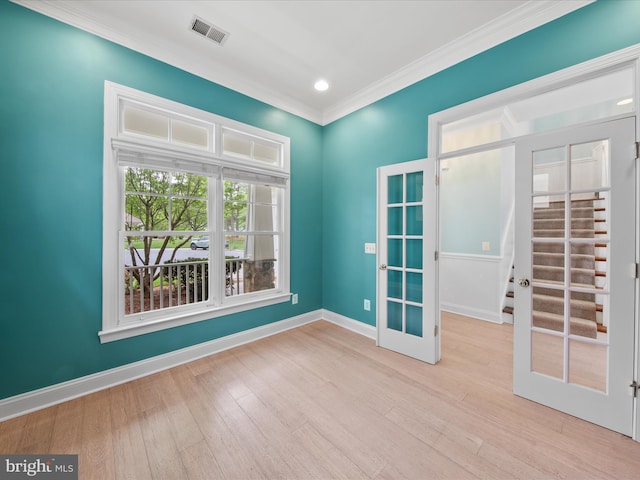 27173 Barefoot Blvd Unit 15, Millsboro, DE 19966 - spare room with french doors, ornamental molding, baseboards, stairs, and wood finished floors