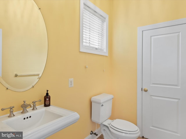 27173 Barefoot Blvd Unit 15, Millsboro, DE 19966 - half bathroom featuring a sink and toilet