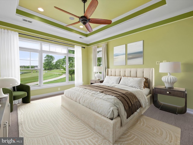 27173 Barefoot Blvd Unit 15, Millsboro, DE 19966 - carpeted bedroom featuring a raised ceiling, ornamental molding, baseboards, and a ceiling fan