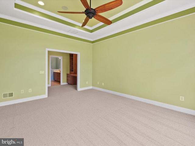 27173 Barefoot Blvd Unit 15, Millsboro, DE 19966 - unfurnished room featuring a tray ceiling, crown molding, carpet, baseboards, and a ceiling fan