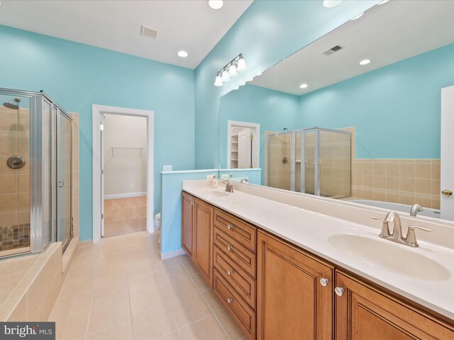 27173 Barefoot Blvd Unit 15, Millsboro, DE 19966 - full bathroom with a stall shower, tile patterned flooring, double vanity, a walk in closet, and baseboards