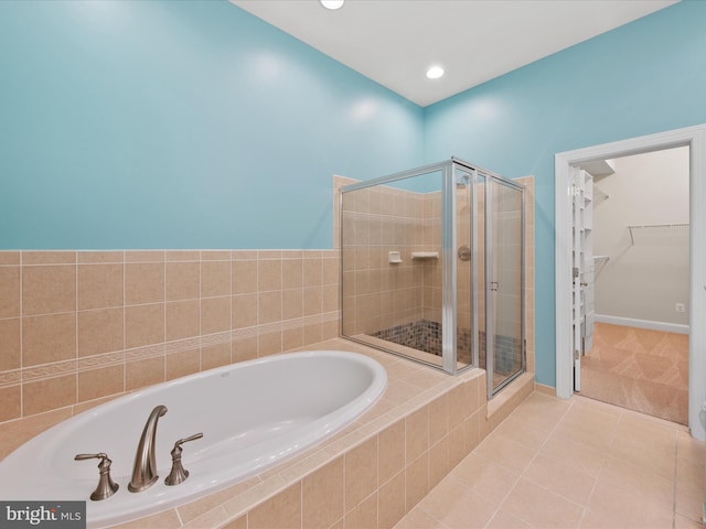 27173 Barefoot Blvd Unit 15, Millsboro, DE 19966 - full bath with a shower stall, a spacious closet, a bath, and tile patterned floors