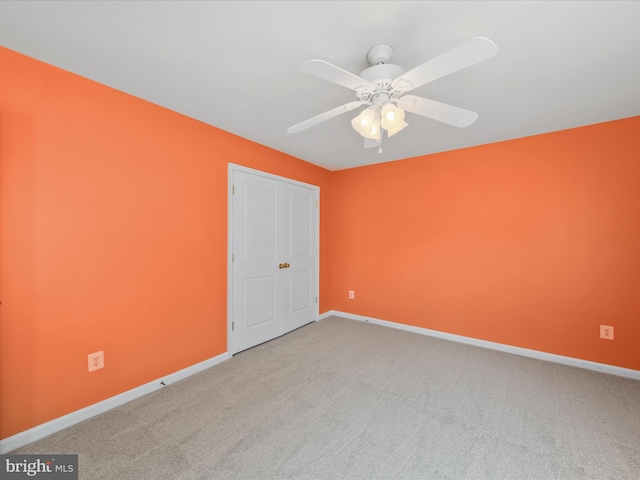 27173 Barefoot Blvd Unit 15, Millsboro, DE 19966 - spare room featuring carpet, baseboards, and a ceiling fan