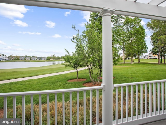 27173 Barefoot Blvd Unit 15, Millsboro, DE 19966 - view of grassy yard featuring a water view, a porch, and view of golf course