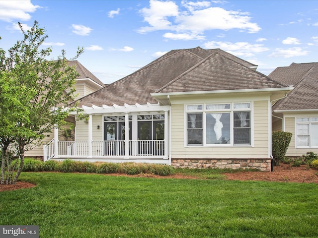 27173 Barefoot Blvd Unit 15, Millsboro, DE 19966 - back of property featuring a lawn, a shingled roof, and a pergola
