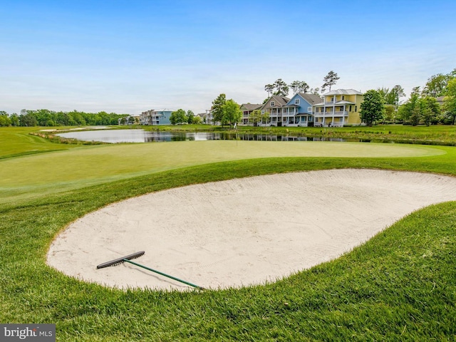27173 Barefoot Blvd Unit 15, Millsboro, DE 19966 - view of home's community featuring a water view, a lawn, and golf course view