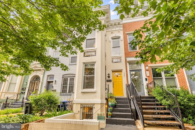 multi unit property featuring brick siding