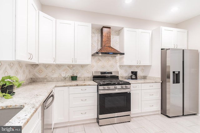 3925 Ashwood Pl, Falls Church, VA 22041 - kitchen with stainless steel appliances, wall chimney range hood, white cabinets, and backsplash