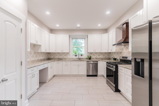3925 Ashwood Pl, Falls Church, VA 22041 - kitchen with appliances with stainless steel finishes, wall chimney range hood, a sink, tasteful backsplash, and light stone countertops