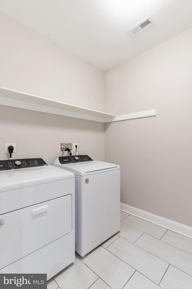 3925 Ashwood Pl, Falls Church, VA 22041 - laundry area with independent washer and dryer, baseboards, and light tile patterned floors