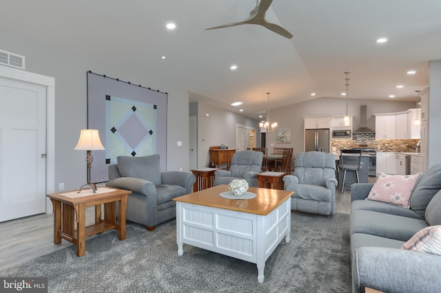 82 S Village Cir Unit 238, Palmyra, PA 17078 - living room with vaulted ceiling, a ceiling fan, a chandelier, recessed lighting, and wood finished floors