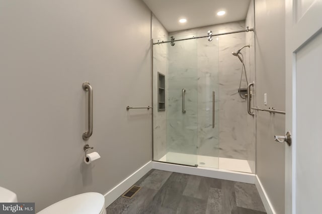 82 S Village Cir Unit 238, Palmyra, PA 17078 - bathroom featuring toilet, a marble finish shower, baseboards, and recessed lighting