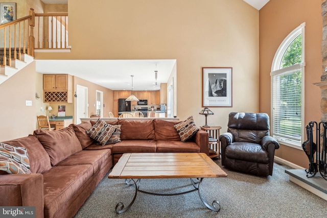 22 Devonshire Dr, Voorhees, NJ 08043 - carpeted living area with a high ceiling, baseboards, and stairway