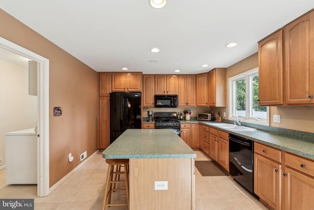 22 Devonshire Dr, Voorhees, NJ 08043 - kitchen featuring black appliances, a kitchen breakfast bar, a sink, a center island, and recessed lighting