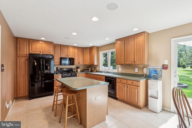 22 Devonshire Dr, Voorhees, NJ 08043 - kitchen featuring black appliances, a kitchen breakfast bar, a center island, a sink, and recessed lighting