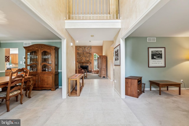 22 Devonshire Dr, Voorhees, NJ 08043 - entryway with a towering ceiling, light colored carpet, baseboards, and a stone fireplace