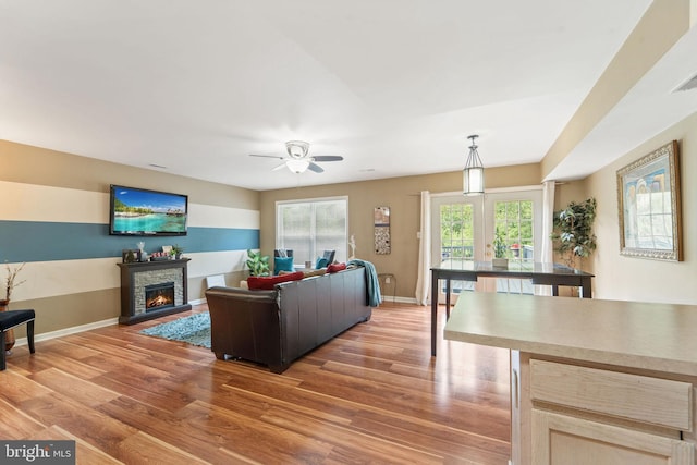 96 High Meadows Dr, Sicklerville, NJ 08081 - living room featuring a fireplace, light wood-style floors, ceiling fan, and baseboards